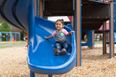 You should never let your child sit on your lap on a slide, expert warns