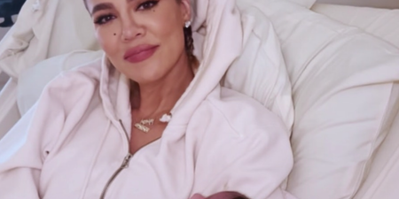 Fans defend Khloe Kardashian for posing in hospital bed with her newborn