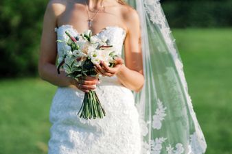 Bride has the best reaction after toddler wipes her face on her wedding dress