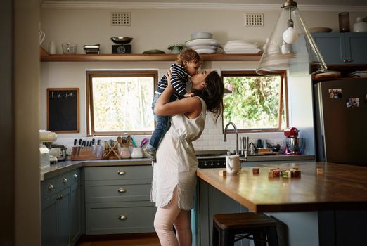 Pregnant mother hugging first child