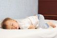 There’s a reason why babies love sleeping with their bum in the air and it’s adorable