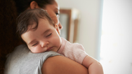 Why does your baby stop crying when you stand up holding them?