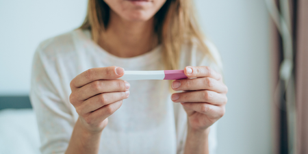 What is an ectopic pregnancy and what are the symptoms?