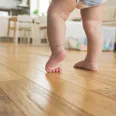 Research suggests that babies who walk early may have greater success later in life